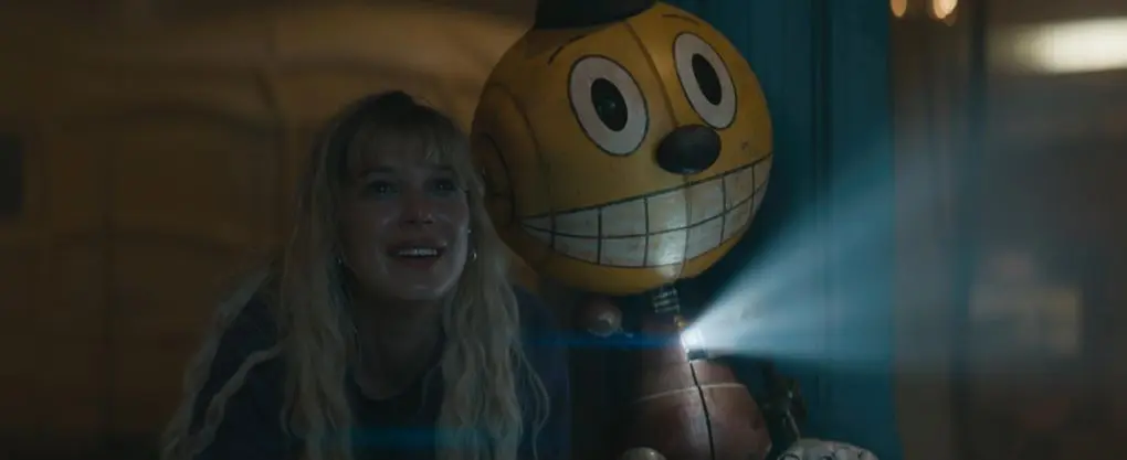Alan Tudyk y Millie Bobby Brown en Estado el&eacute;ctrico (2025) / IMDb