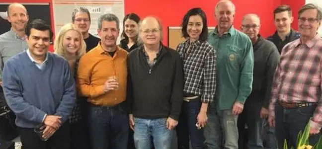 Dave Whitlock en el centro con sus compañeros de trabajo.