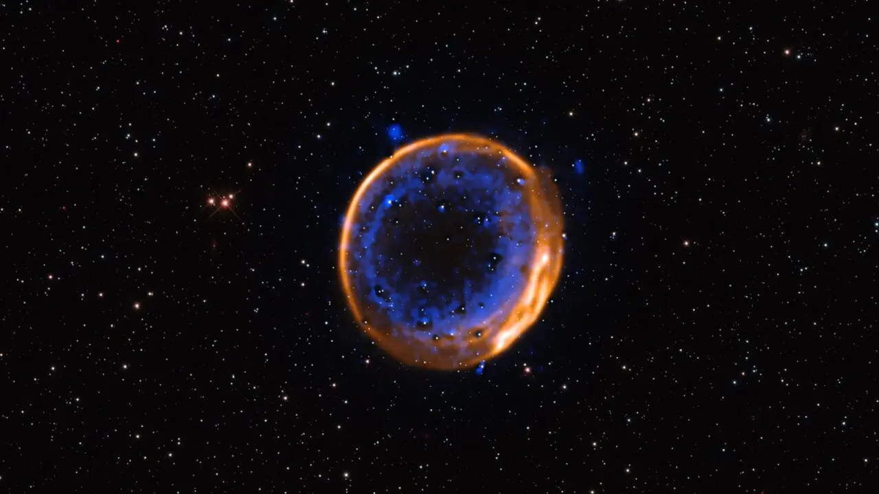 Restos en expansi&oacute;n de la supernova SNR 0509-67.5. / ESO/P. Das et al. Background stars (Hubble): K. Noll et al.