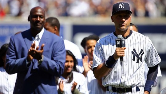 NEW YORK, NY - SEPTEMBER 07:  Derek Jeter #2 of the New York Yankees speaks to the crowd as basketball hall of famer Michael Jordan (L) looks on during Derek Jeter Day on September 7, 2014 before the game between the New York Yankees and the Kansas City Royals at Yankee Stadium in the Bronx borough of New York City.  (Photo by Al Bello/Getty Images)